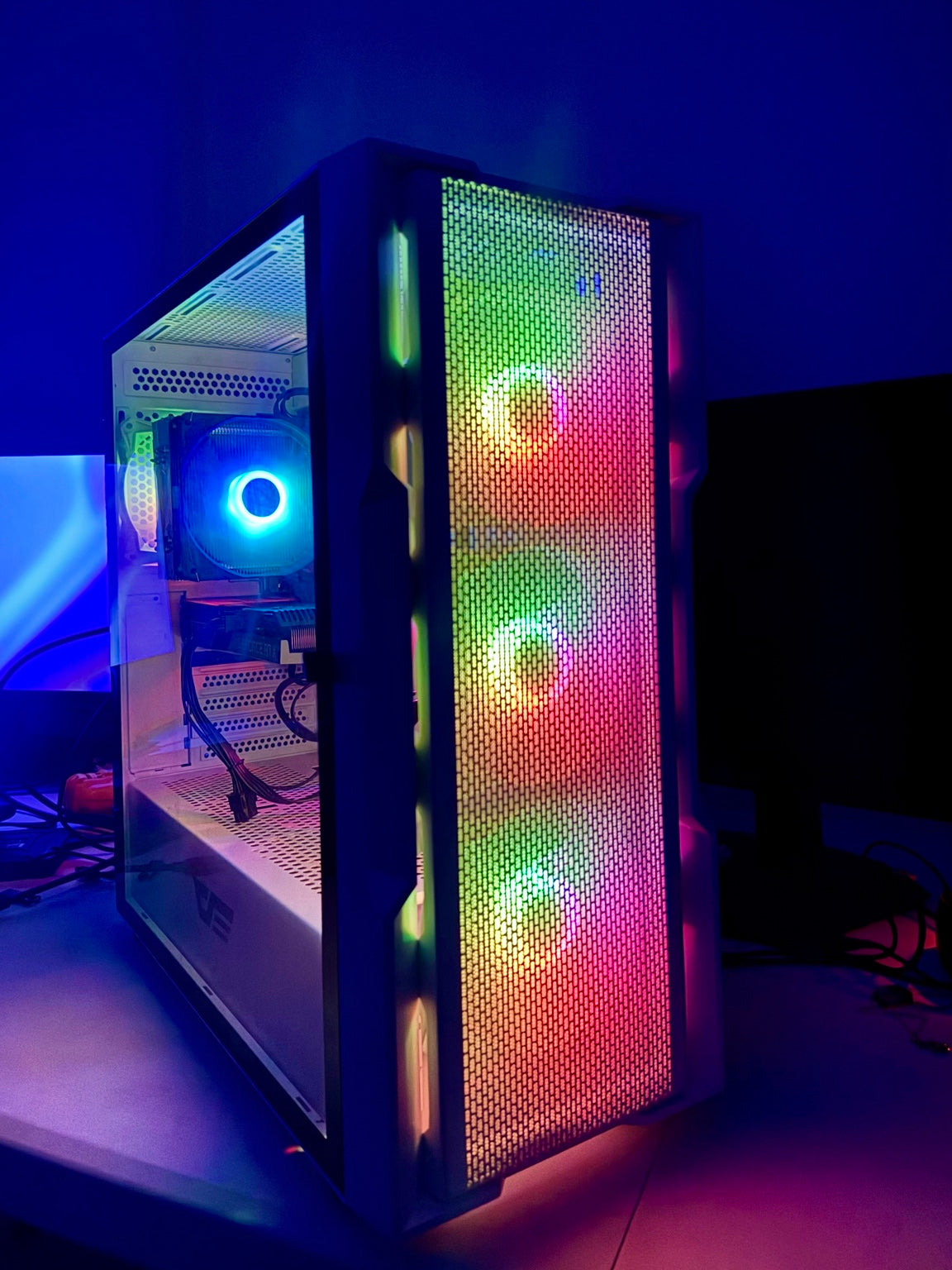 Real used gaming PC darkFlash DK431 white case with RGB lighting in dark setting